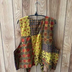 Never worn , One size mixed fabric and multi colored handmade vest